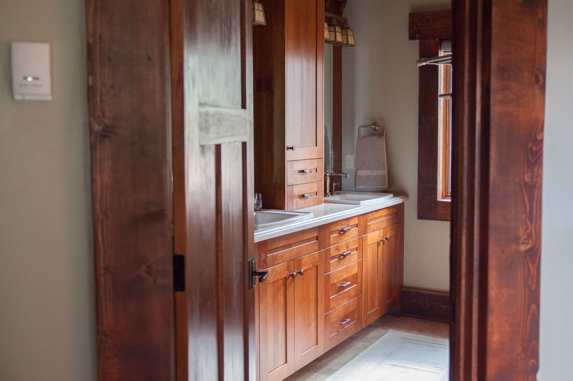craftsman bathroom with built-in cabinetry